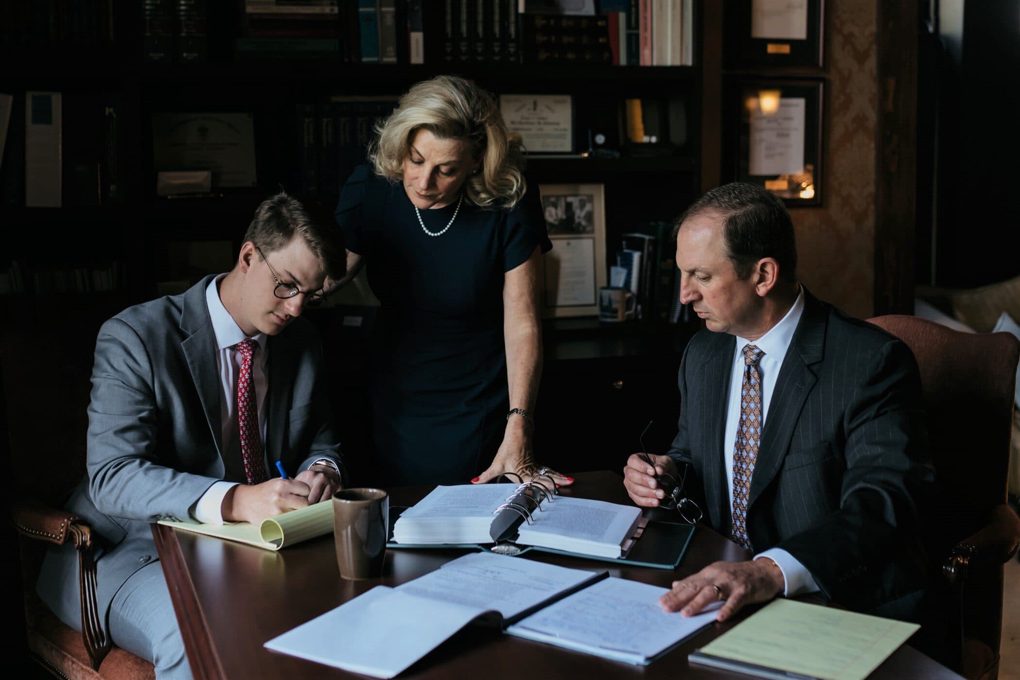 Culotta & Culotta LLP partners at work in the firm library.